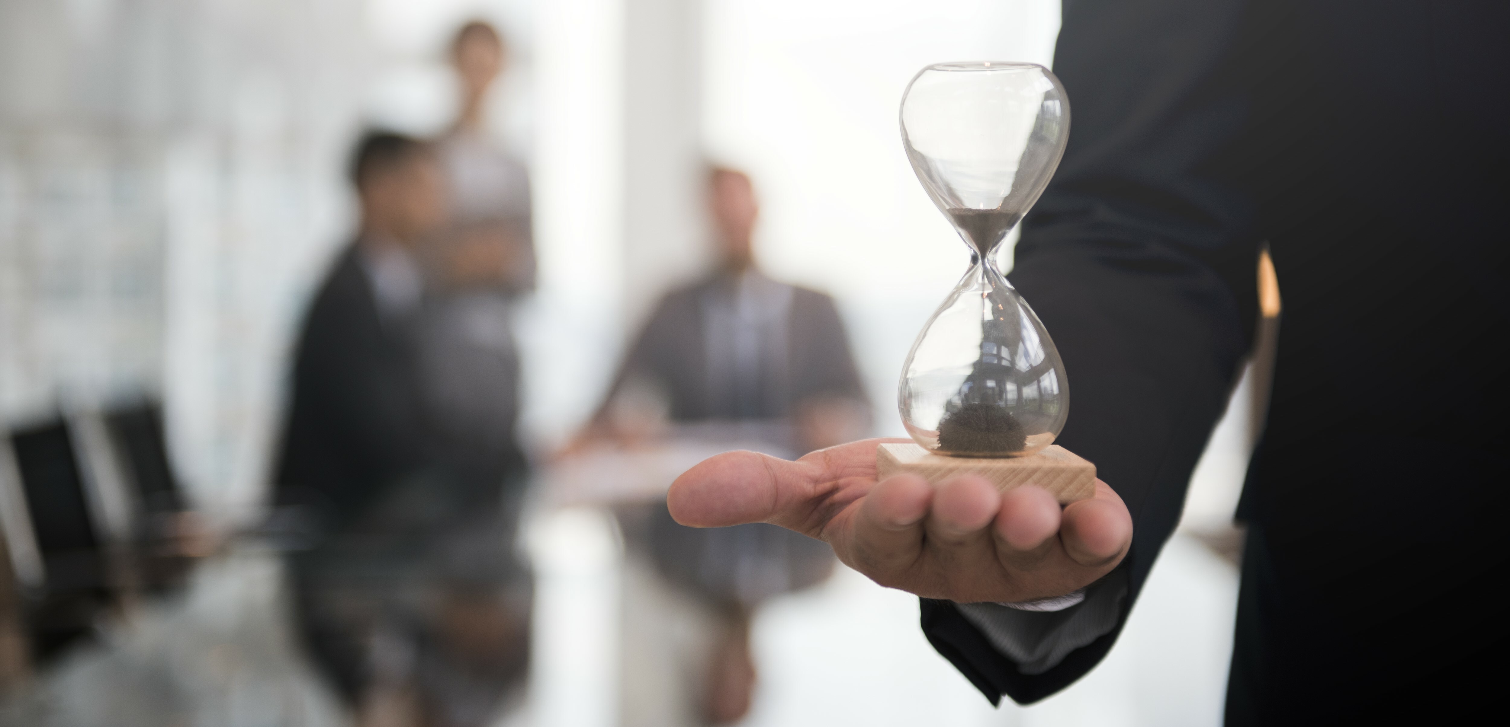 businessman-holding-hour-glass-signifies-importance-being-time